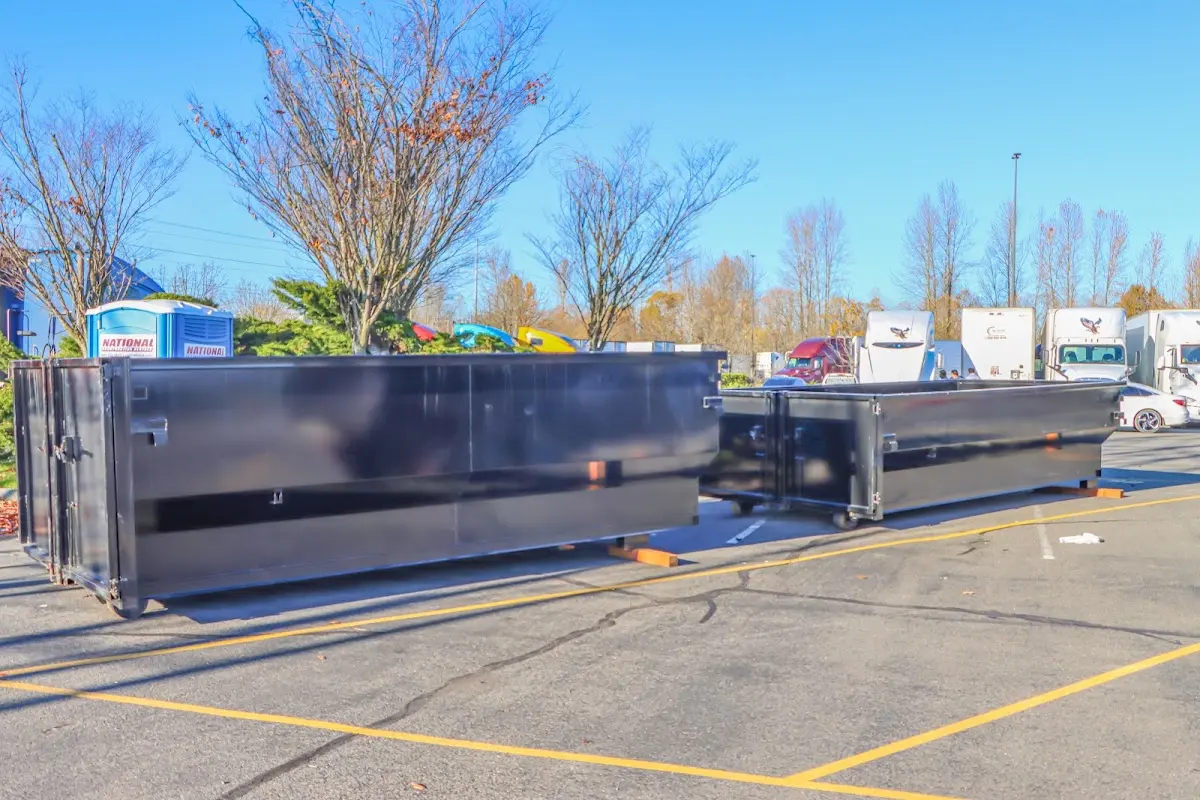 Professional dumpster rental service with roll-off container on residential driveway in Lucas Valley-Marinwood